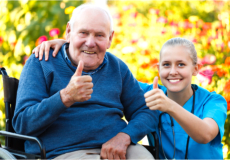 Nurse and senior doing a thumbs-up sign